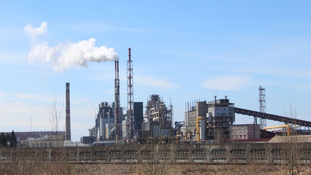 industrial factory with emissions under blue sky