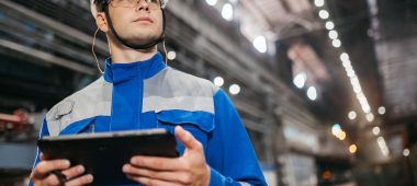 industrial worker using tablet in factory